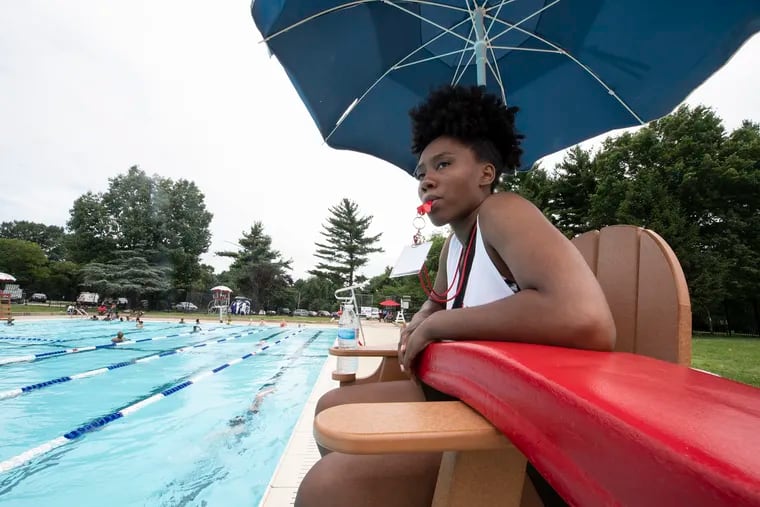 Lifeguard Khadijah Davis looks over swimmers at Kelly Pool in Philadelphia in 2019.