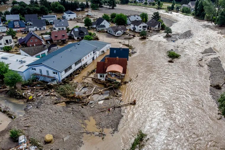 Damaged houses are seen at the Ahr river in Insul, western Germany, on Thursday.