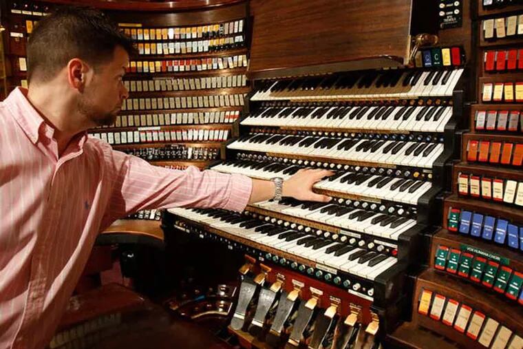 Macy's employee J. Anthony Nichols plays the Wanamaker Organ at Macy's in Philadelphia during a preview tour for the Philly Open House tours on April 29, 2013. ( DAVID MAIALETTI  / Staff Photographer )