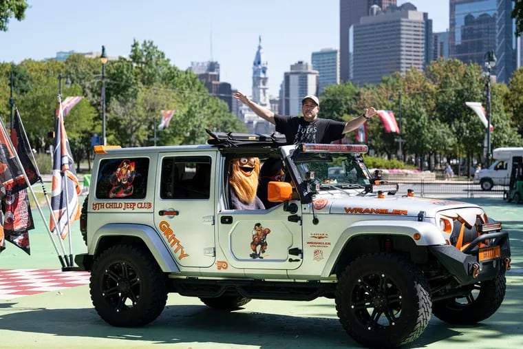 Pedro Cancel of North Philly with "Gritty," the Jeep Wrangler he has decorated in honor of the Flyers' mascot.