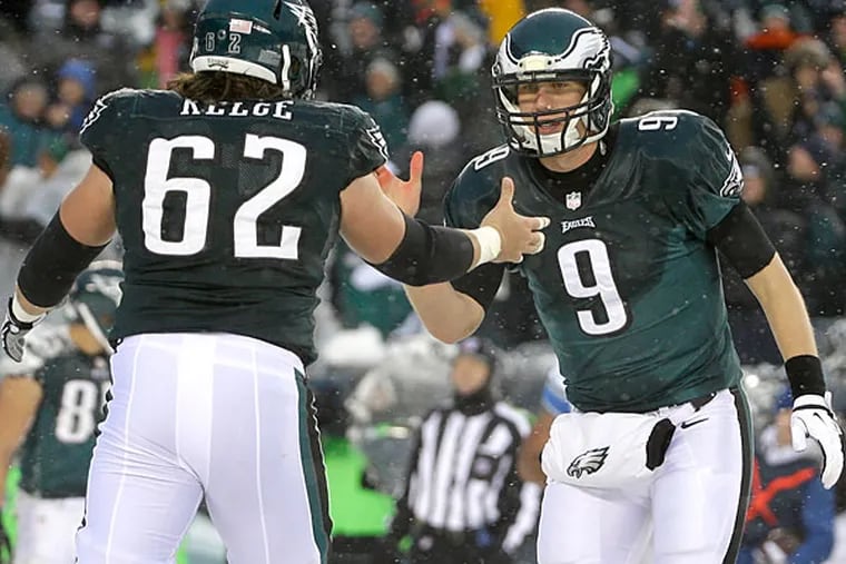 Nick Foles, right, and Jason Kelce celebrate after a two-point conversion during the second half of an NFL football game, Sunday, Dec. 8, 2013, in Philadelphia. (Matt Rourke/AP)