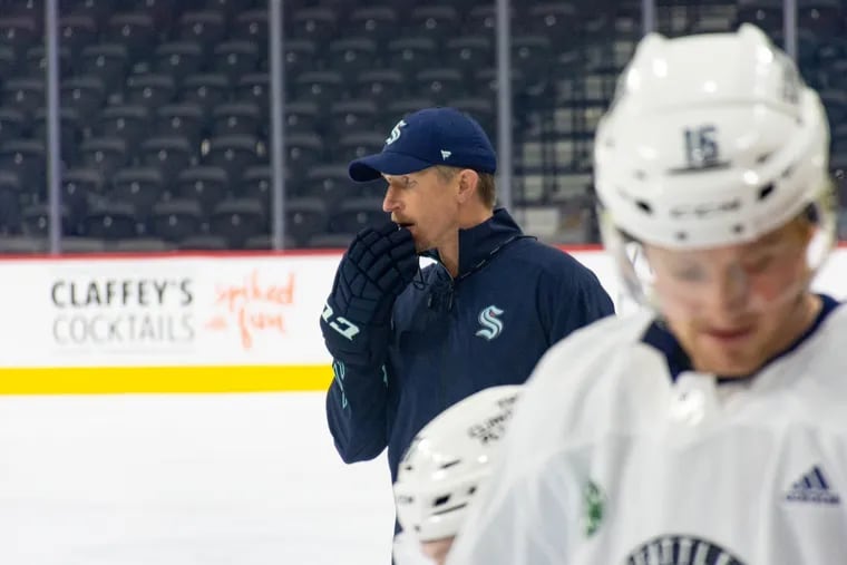 Seattle Kraken coach Dave Hakstol directs morning skate before the Monday, Oct. 18, 2021 game against his former team, the Philadelphia Flyers.