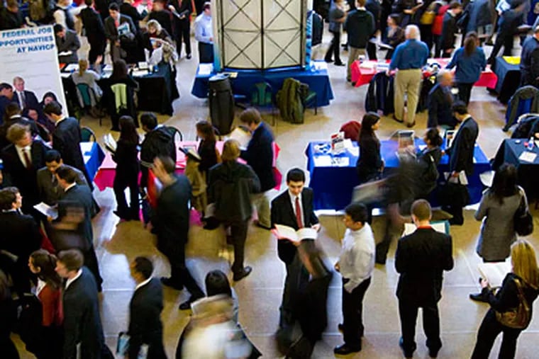 Job seekers at a Rutgers jobs fair. Federal legislation threatens benefits that had risen with the state's high unemployment rate.