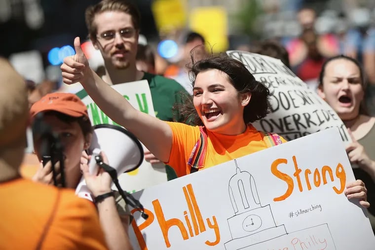 Anna Sophie Tinneny, 18, a recent Pennridge High School graduate, chants during the Still Marching Philadelphia rally supporting gun control legislation in Center City on Saturday, July 7, 2018. The march, organized by local high school students, including Tinneny, was intended to renew attention on gun control after the wave of student activism following February's Parkland, Fla., high school shooting.
