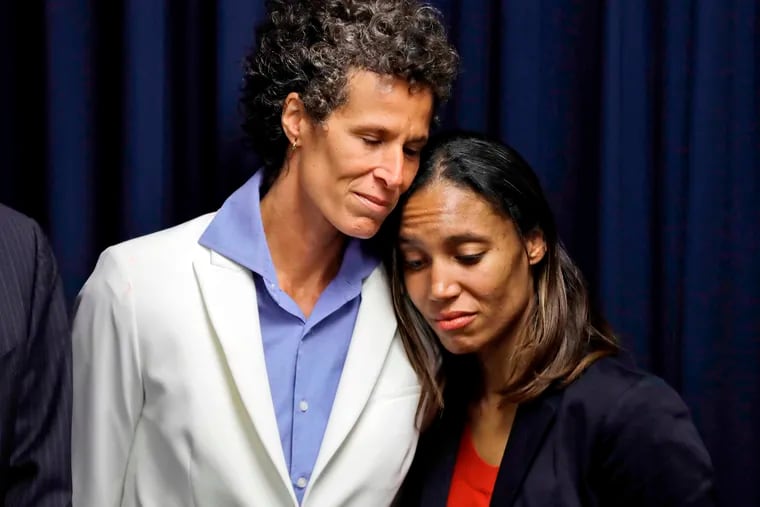 Bill Cosby accuser Andrea Constand, left, embraces prosecutor Kristen Feden during a news conference after Cosby was found guilty in his sexual assault retrial in Norristown, Pa., on April 26, 2018. Cosby's conviction was reversed on June 30, 2021, and the vast majority of the women who accused him of assault will not see their cases reach the courtroom.