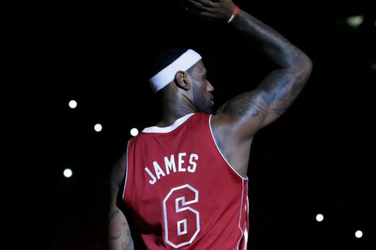 The Heat's LeBron James (6) stands on the court during team introductions before an NBA basketball game against the Charlotte Bobcats, Sunday, Dec. 1, 2013, in Miami. (Lynne Sladky/AP)