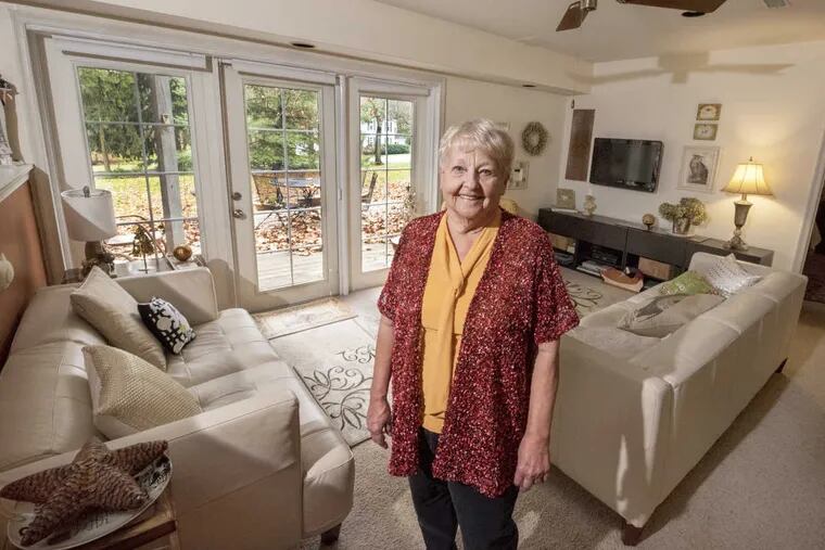 Gerri Boyd, 76, stands in her living room in the 1,000-square foot basement in-law suite of her daughter and son-in-law’s home in West Chester.