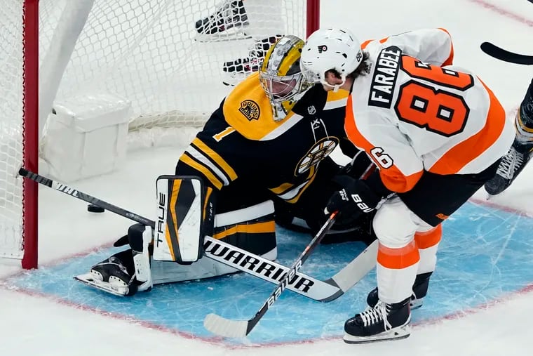 Flyers left wing Joel Farabee scores past Boston Bruins goaltender Jeremy Swayman in the first period of Thursday's preseason game at TD Garden.