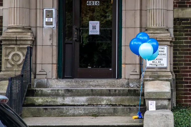 Balloons were placed on the steps of an apartment building on the 4800 block of Pine Street in West Philadelphia on Tuesday, the day after a 5-year-old boy died in an apartment, allegedly at the hands of his mother. The boy was found with a stab wound to his neck and was facedown in a bathtub. The balloons were later on Tuesday seen tied to the black metal railing by the outdoor steps.