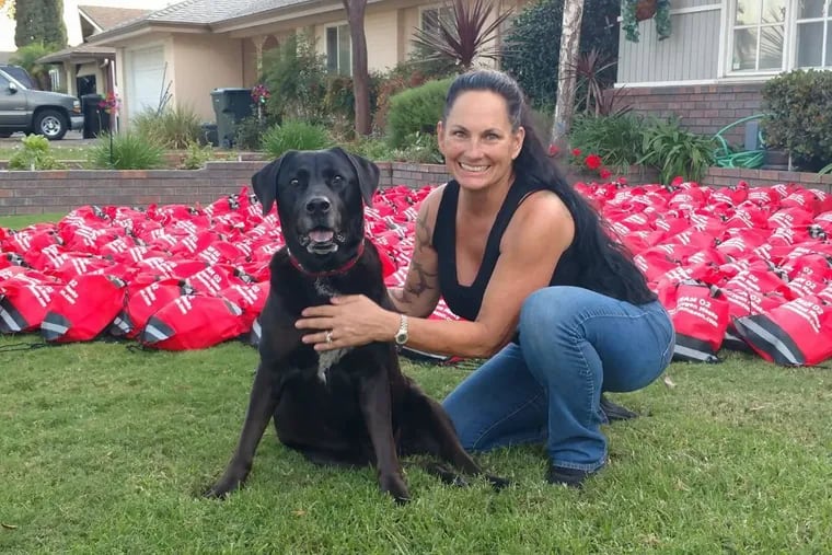 Debra Jo Chiapuzio at home earlier this year in Anaheim, Calif., with her dog, Emma Zen, and dozens of pet oxygen masks.