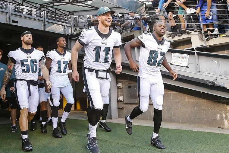 Eagles defensive end Chris Long, wide receiver Alshon Jeffery, quarterback Carson Wentz and wide receiver Torrey Smith leave the tunnel and enter the field before the Eagles played New York Jets in a preseason game.