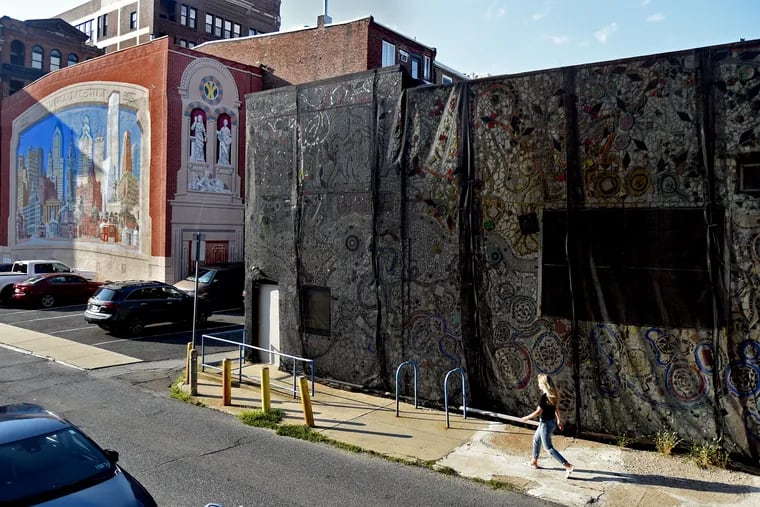 The iconic Painted Bride building in Old City September 4, 2019, where it has been draped in black netting all summer, covering the enveloping mosaic by artist Isaiah Zagar.