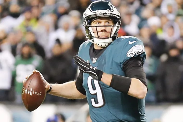 Quarterback Nick Foles holds the football against the Atlanta Falcons during the Eagles’ 15-10 win in NFC Divisional Playoff game on Saturday.