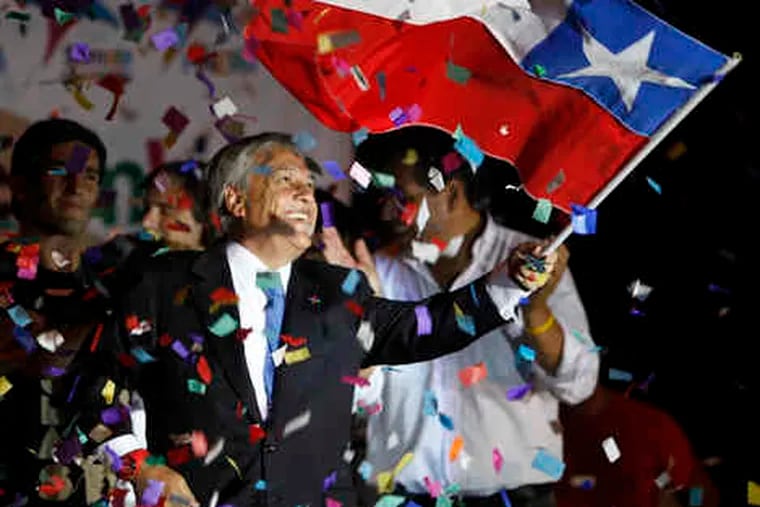 Sebastian Pinera waves a flag in Santiago after his lead in the elections. If Pinera wins a runoff, Chile will have its first right-wing government since the Pinochet regime.