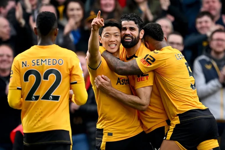 Hwang Hee-Chan of Wolverhampton Wanderers celebrates with teammates after scoring during the Premier League match between Wolverhampton Wanderers and Brentford FC at Molineux on April 15, 2023 in Wolverhampton, England. (Photo by Clive Mason/Getty Images)