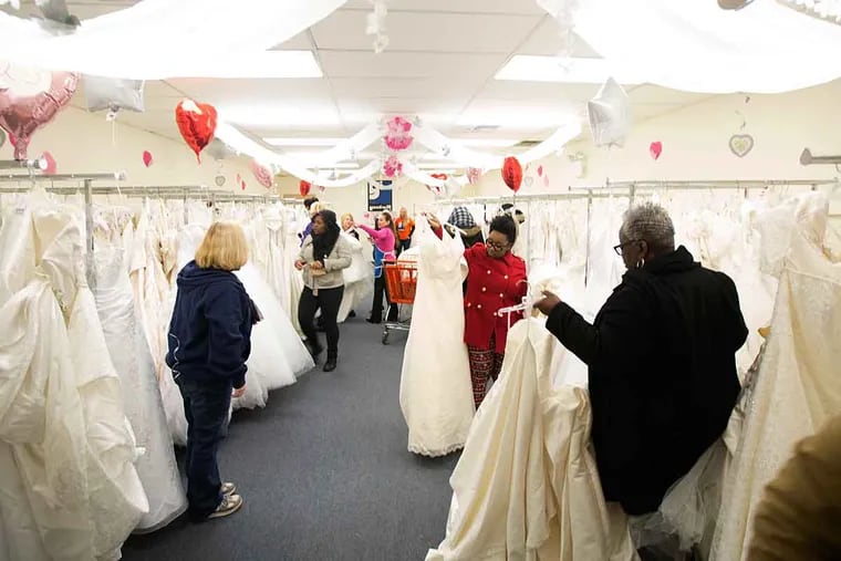 Brides-to-be browse at the Goodwill store on Route 70. The store’s annual bridal sale is Saturday.