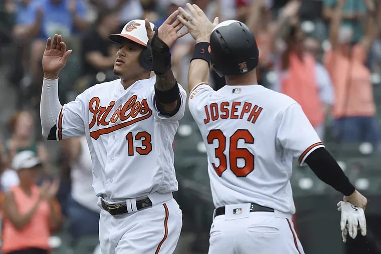 If he's traded to the Phillies, Manny Machado (left) could take over the cleanup spot now manned by Carlos Santana.