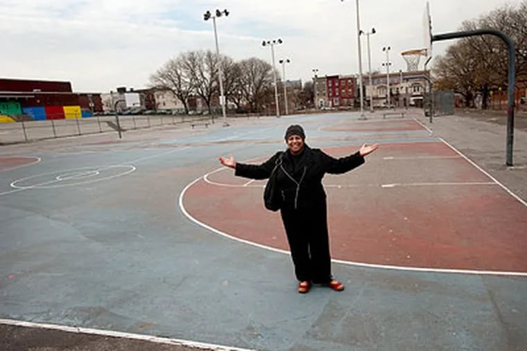Judith Robinson, a North Philadelphia community activist, stands on the parcel the school district has given to the city for $1. (Sharon Gekoski-Kimmel / Staff Photographer)