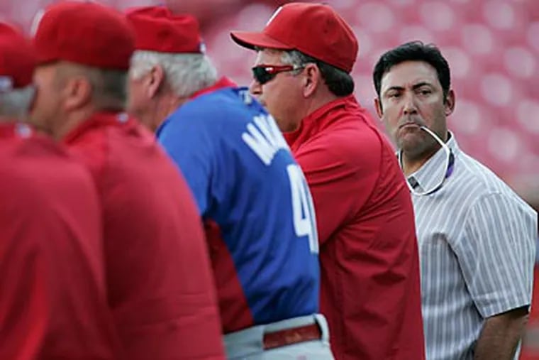 General manager Ruben Amaro, right, has had a hand in some of the Phillies' good fortune. (Michael Bryant/Staff Photographer)