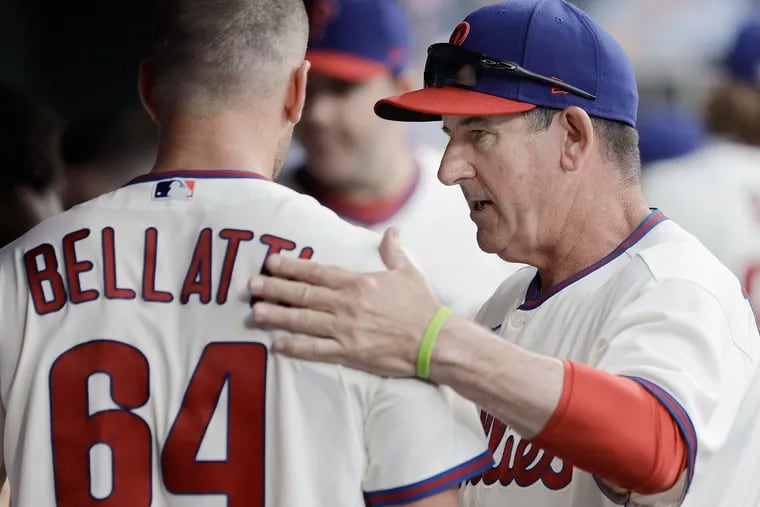 Phillies pitcher Andrew Bellatti gets a pat on the back from coach Rob Thompson after Bellatti pitched the sixth inning against the Cardinals on July 2.