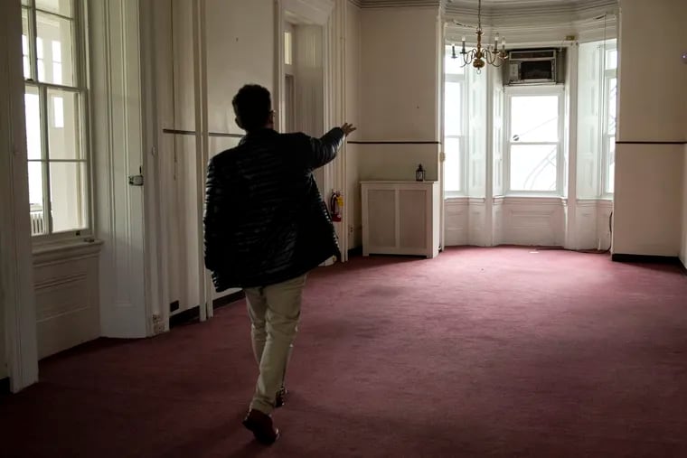 William Valerio, Director and CEO of Woodmere Art Museum, walks through the recently acquired historic mansion showing the rooms and spaces that will be converted and renovated, on Tuesday, April 19, 2022.