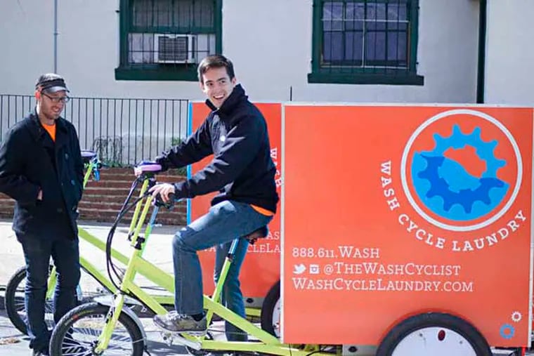 Gabriel Mandujano (right), founder of Wash Cycle Laundry, aboard one of his company's tricycles. With him was employee Jake Clark. &quot;The blessing and the curse of laundry is that everybody has to do it,&quot; Mandujano says.