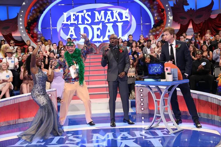Host Wayne Brady and cast haggling with a contestant on CBS hit "Let's Make a Deal" in April.