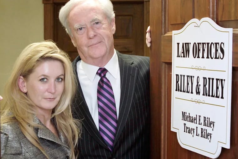 Tracy and Mike Riley at their law office in Mount Holly. (Elizabeth Robertson / Staff Photographer)
