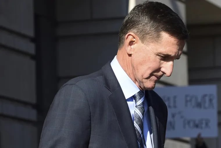 Michael Flynn leaves federal court in Washington on Friday after pleading guilty to making false statements to the FBI.