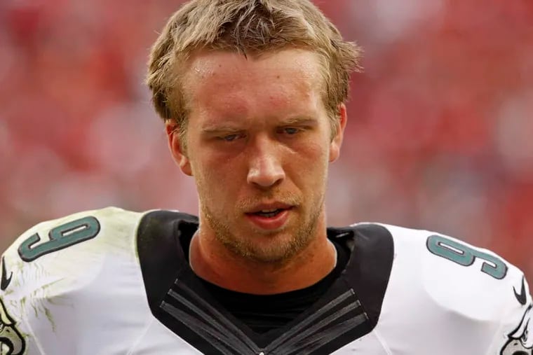 Eagles quarterback Nick Foles, whose season was cut short by injury, did not get a ringing endorsement on his future from owner Jeffrey Lurie or coach Chip Kelly. RON CORTES / Staff