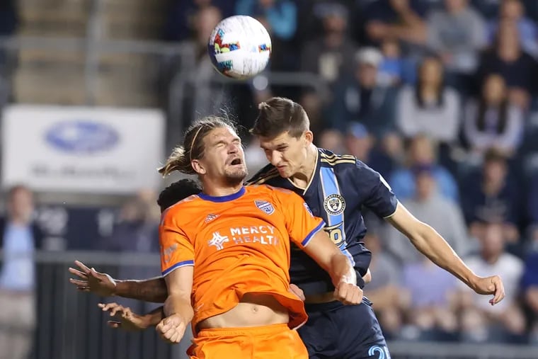 Chris Donovan, right, of the Philadelphia Union goes up for the ball against Nick Hagglund of FC Cincinnati during their game on June 18, 2022,  at Subaru Stadium in Chester, PA.