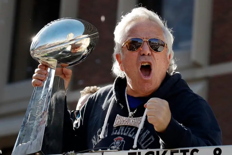 New England Patriots owner Robert Kraft yells to fans during their Super Bowl victory parade through downtown Boston earlier this month.