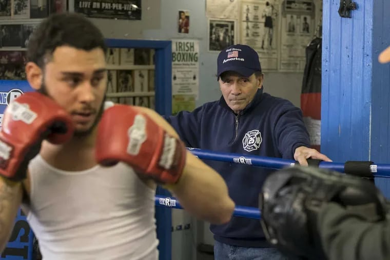 Charles &#039;Charlie&#039; Sgrillo watches from the ropes as 17-year-old Andy Martinez (left) spars with coach Timmy Sinese. Sgrillo has run the famous Harrowgate boxing gym in Kensington for nearly 50 years, training generations of fighters and helping countless kids.