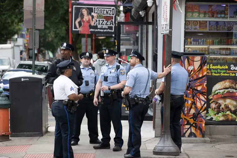 Police patrol on South Street on Saturday.