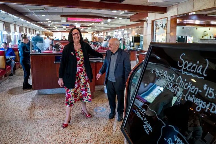 Hainesport Mayor Leila Gilmore, a Diamond Diner regular, bids farewell to owner Gus Diamantis (right) after stopping for breakfast before the diner closed on Sunday afternoon.