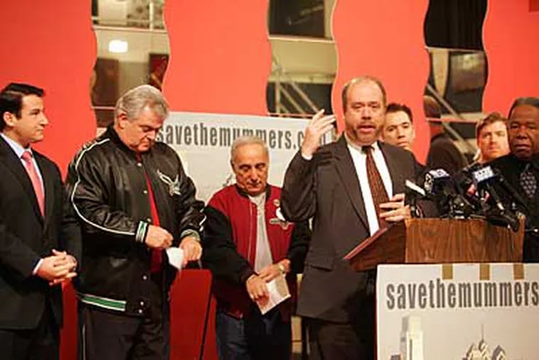 (Left to right) State Sen.-elect Larry Farnese, U.S. Rep. Bob Brady, Joey Vento of Geno's Steaks and George Badey, an attorney for the Mummers, announce the donations. (David Swanson / Staff Photographer)