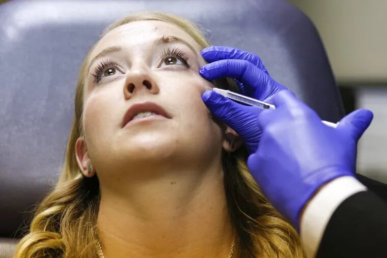 Katy Young, 28, receives a Botox injection from Cherry Hill plastic surgeon Steven Davis.