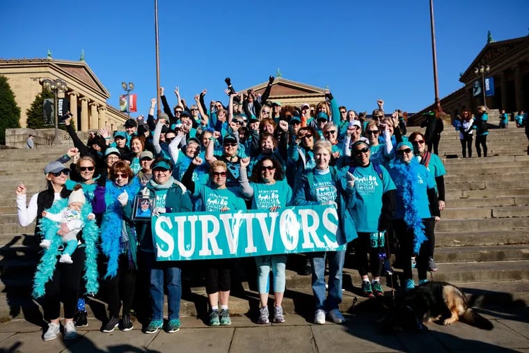 Ovarian cancer survivors celebrate in front of the Art Museum after the Sandy Sprint.