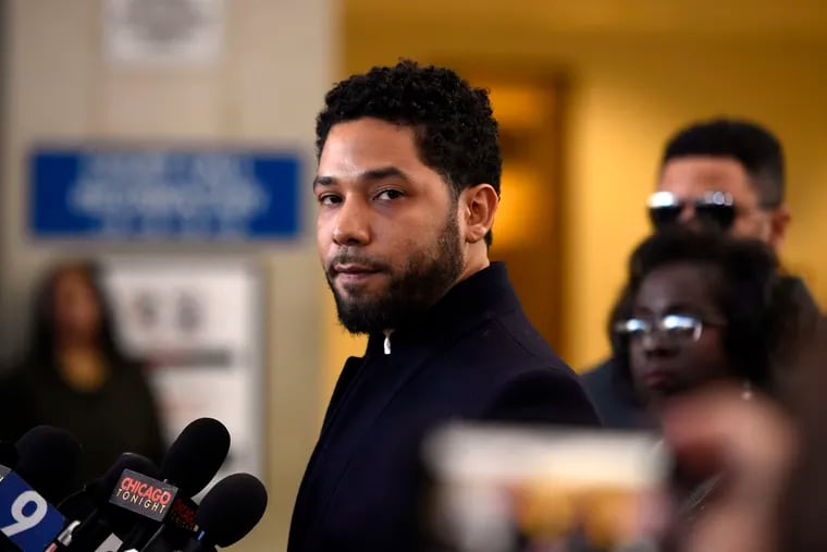 FILE - This March 26, 2019 file photo shows actor Jussie Smollett before leaving Cook County Court after his charges were dropped in Chicago. Fox Entertainment says Smollett will not return to its series “Empire” in the wake of allegations by Chicago officials that the actor lied about a racially motivated attack. The studio released a statement Tuesday, April 30,  saying “there are no plans for Smollett’s character of Jamal to return to ‘Empire.’” No reason was given. (AP Photo/Paul Beaty, File)