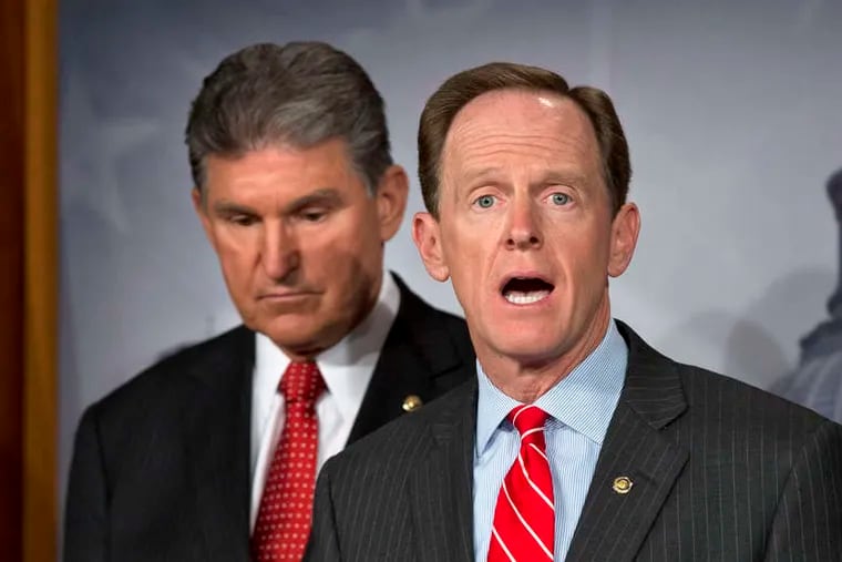 U.S. Sens. Joe Manchin (left) and Pat Toomey reached a bipartisan deal for background checks.
