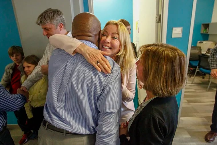 Former Philadelphia Daily News editor Michael Days is embraced by reporter Barbara Laker after learning the Toxic City team was a finalist for the 2019 Pulitzer prize. The Philadelphia Inquirer and Daily News, April 15, 2019.