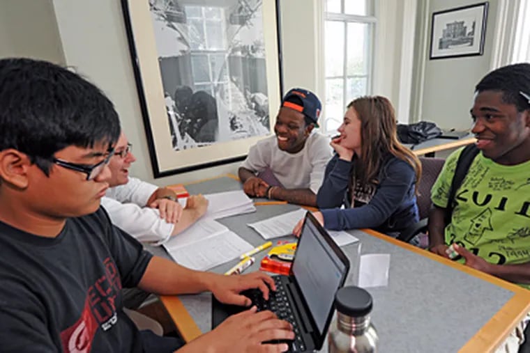 Among the 28 students who took a leap of faith by leaving their neighborhood high schools are Kenrick Tan (left) and (from right) Rasheed Bonds, Angelina Rementer, and Allen Robinson. (April Saul / Staff Photographer)