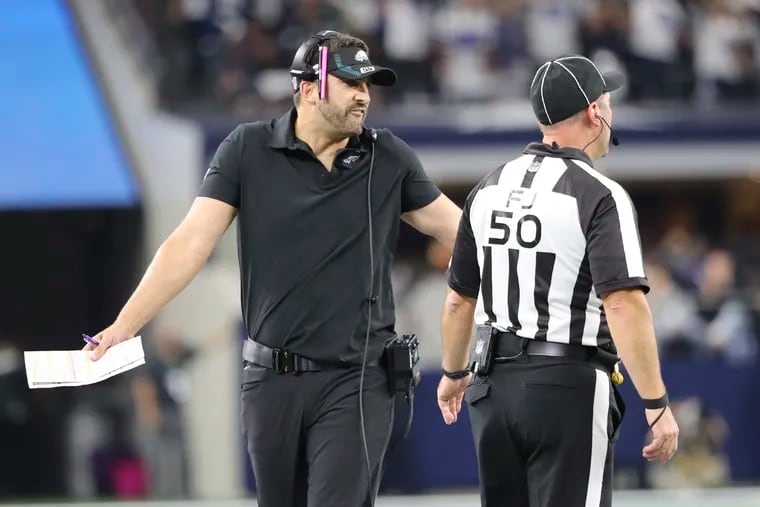 Eagles coach Nick Sirianni talks to an official during the team's 41-21 loss Monday night to the Cowboys.