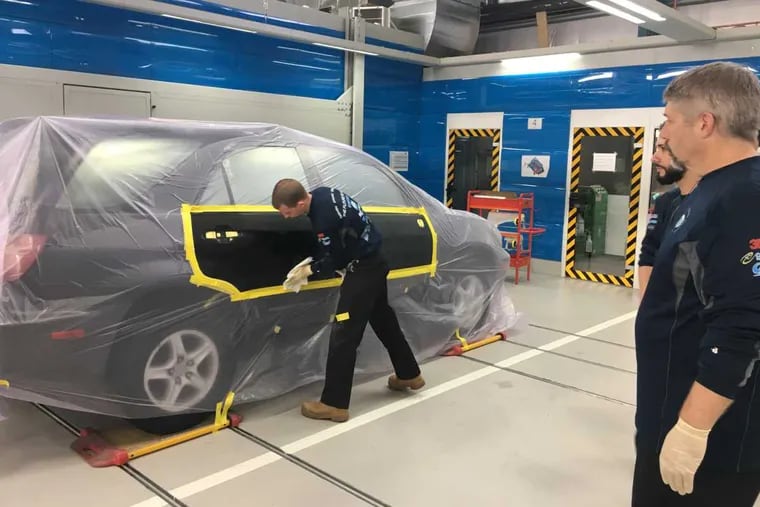 Ready for its 3D closeup: an SUV rolls down the line (note the track system under the wheels) in preparation for the first of two infrared heat treatments.
