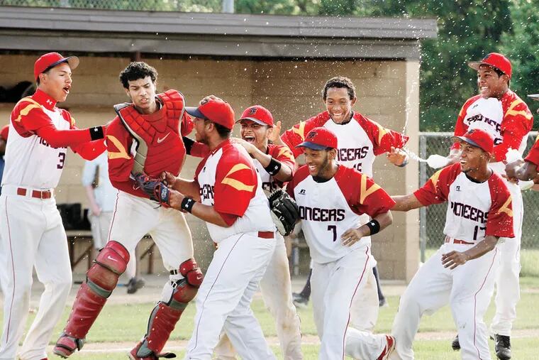 Frankford rushes to pitcher Eduardo Sanchez (third from left) after the team won the P.I.A.A. District XII Philadelphia Pubic League Baseball Championship, defeating Franklin Towne Charter, 9-2.  ( MICHAEL S. WIRTZ / STAFF PHOTOGRAPHER ). May 29, 2013.