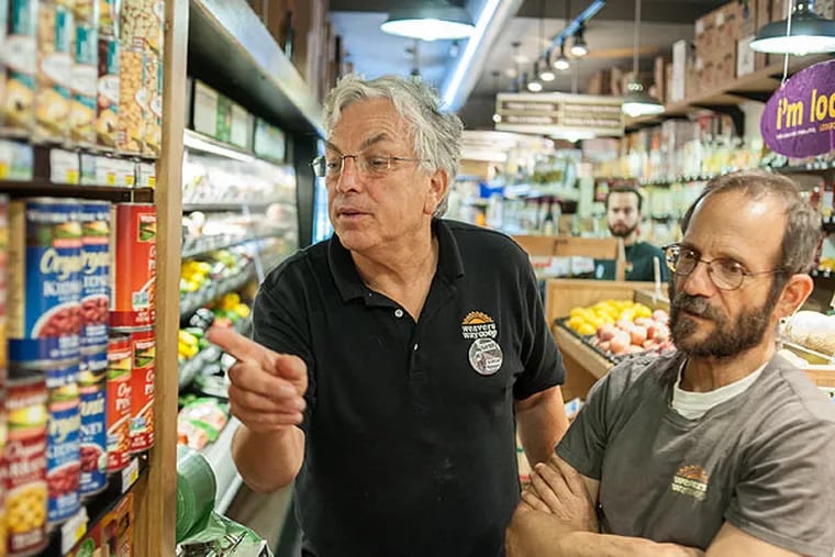 Weaver's Way Co-Op General Manager Glenn Bergman (left) and Purchasing Manager Norman Weiss say theur Mt. Airy food co-op is debating a boycott of Eden Foods because of their stance on the Affordable Care Act. (Matthew Hall / Staff Photographer)
