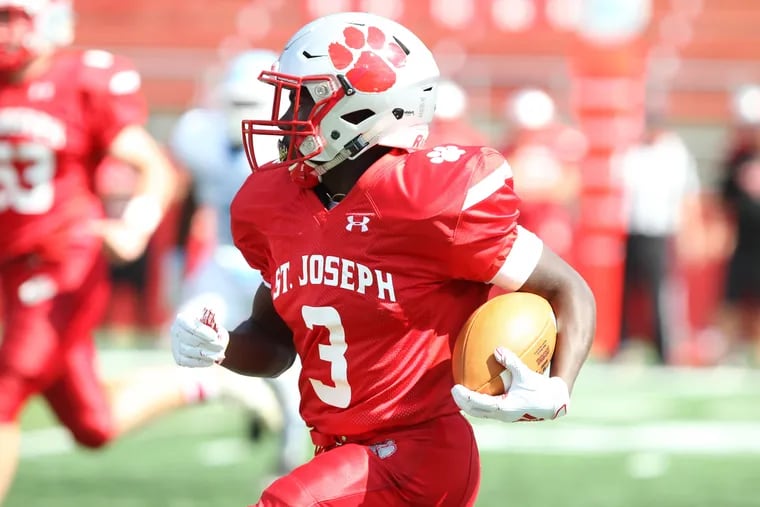St. Joseph's Jada Byers carries the ball for a touchdown against Highland on Saturday, August 31, 2019.