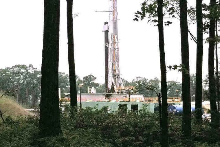 A drilling site is visible through cleared trees along Mid State Trail, which runs 260 miles from the Maryland border into Tioga County. Marcellus Shale drilling appears to be walloping the land on a new scale.