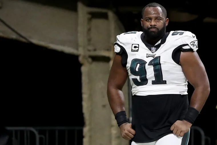 Defensive tackle Fletcher Cox, one of the Eagles injured during the game, leaves the field in the fourth quarter against the Saints.