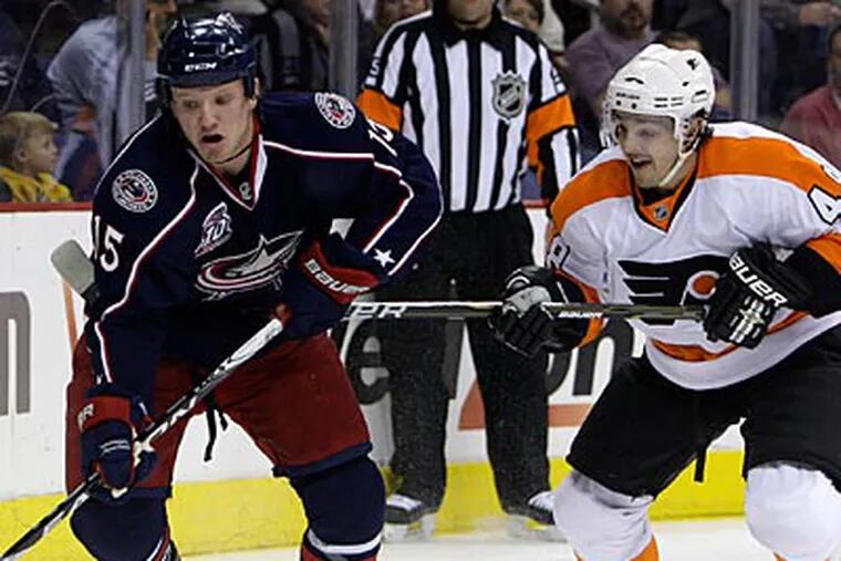 Danny Briere chases Columbus' Derek Dorsett during tonight's 2-1 loss to the Blue Jackets. (AP Photo/Jay LaPrete)